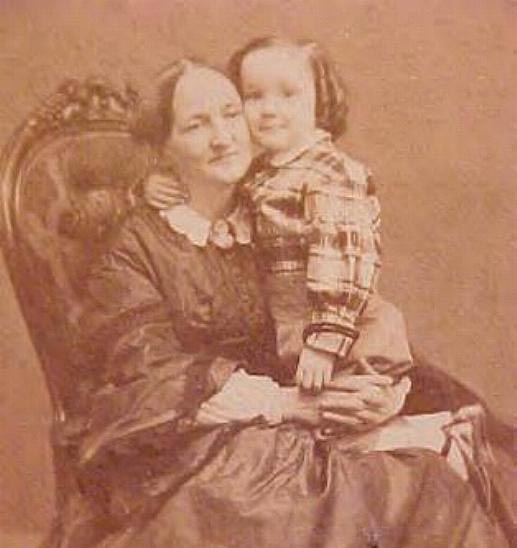 Old sepia toned photograph of Nicea Howard as a child sitting in Eliza Gardner Howard's lap as a child